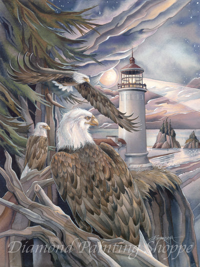 Diamond painting kit illustration features three majestic bald eagles perched and flying near a lighthouse at sunset, with dramatic skies, trees, and coastal scenery.


